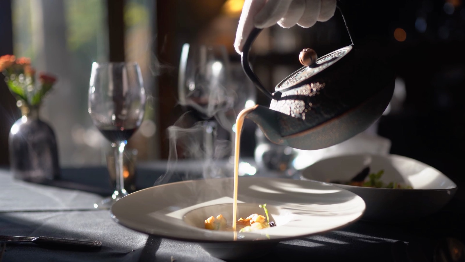 A careful pour at the table